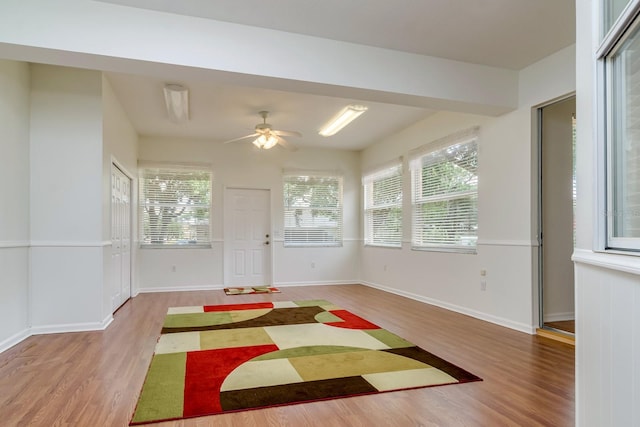 2214 Deerbrook Dr, Lakeland, FL 33811 - foyer featuring light wood-style floors, a ceiling fan, and baseboards