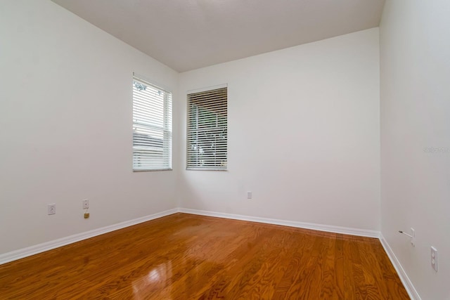 2214 Deerbrook Dr, Lakeland, FL 33811 - unfurnished room with wood finished floors and baseboards