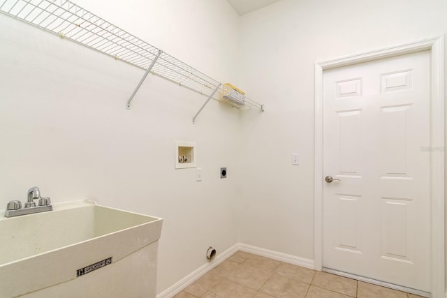 2214 Deerbrook Dr, Lakeland, FL 33811 - clothes washing area featuring hookup for a washing machine, electric dryer hookup, baseboards, and light tile patterned flooring