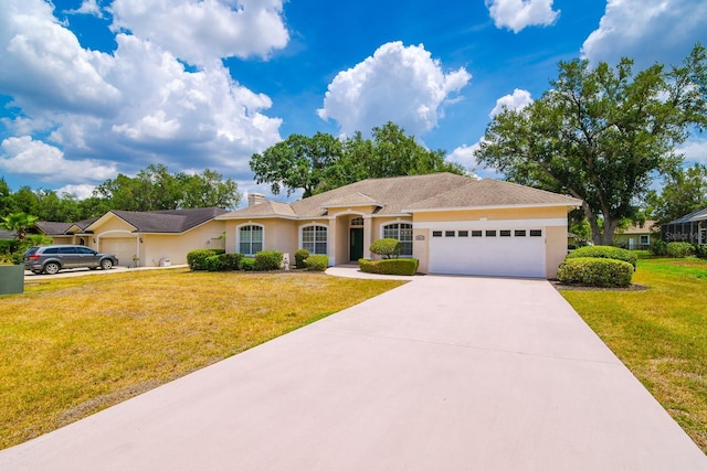 2214 Deerbrook Dr, Lakeland, FL 33811 - ranch-style house featuring an attached garage, stucco siding, a front yard, and concrete driveway
