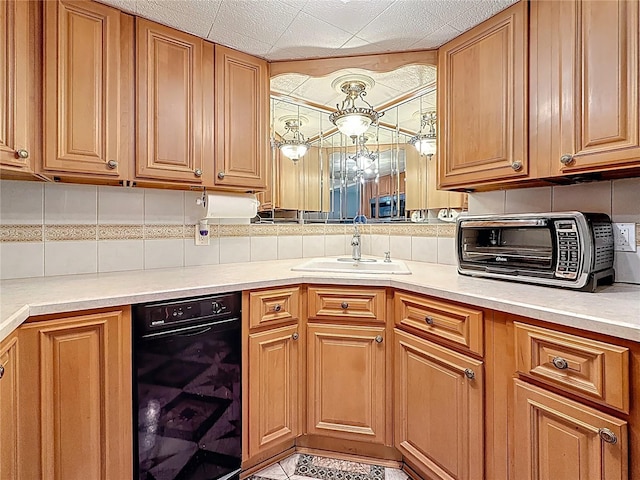 kitchen featuring wine cooler, a sink, light countertops, tasteful backsplash, and brown cabinets