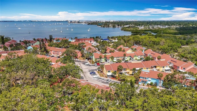 view of property location with a large body of water and nearby suburban area