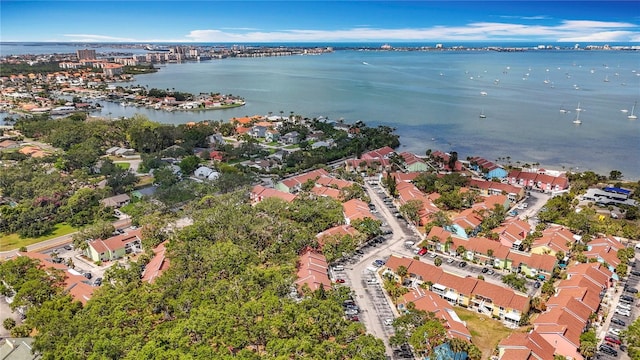 aerial overview of property's location with a nearby body of water and nearby suburban area