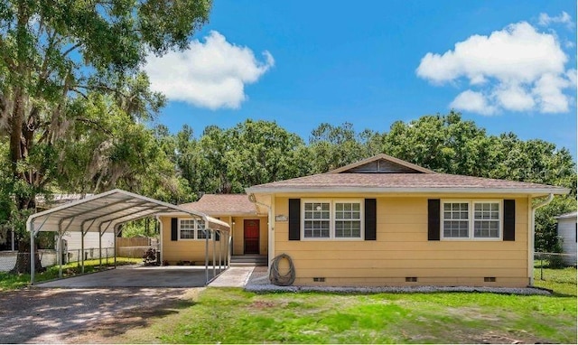 39542 Friends Ave, Zephyrhills, FL 33540 - view of front of house featuring crawl space, asphalt driveway, a carport, and a shingled roof