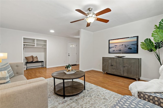 39542 Friends Ave, Zephyrhills, FL 33540 - living area featuring wood finished floors, ceiling fan, and recessed lighting
