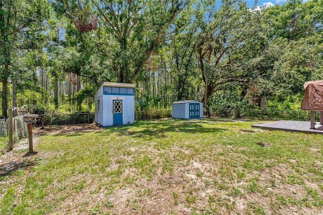 39542 Friends Ave, Zephyrhills, FL 33540 - fenced backyard with a shed and a deck