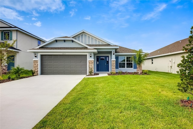 craftsman inspired home featuring an attached garage, a front lawn, driveway, stone siding, and a shingled roof