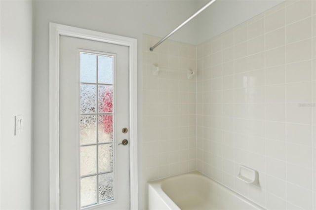 bathroom featuring  shower combination
