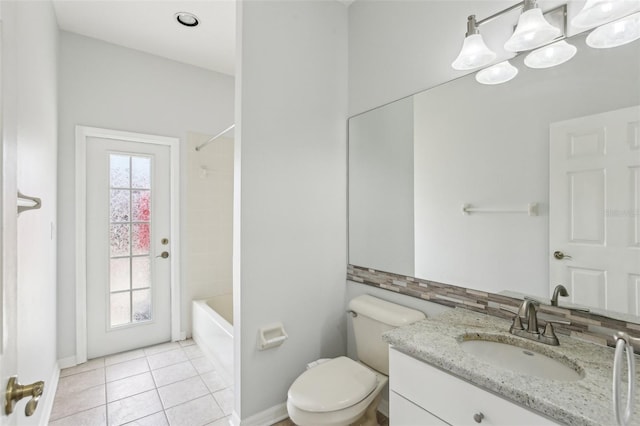 full bathroom featuring vanity, tile patterned floors, toilet, baseboards, and  shower combination