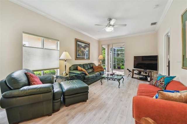 3762 Darston St, Palm Harbor, FL 34685 - living area with ceiling fan, healthy amount of natural light, light wood-style floors, and crown molding