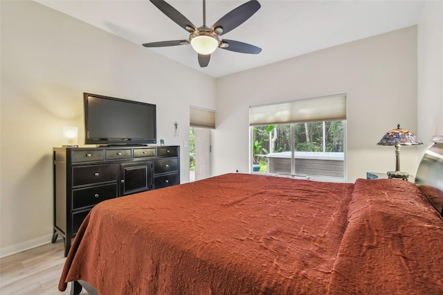 3762 Darston St, Palm Harbor, FL 34685 - bedroom with light wood finished floors, access to exterior, baseboards, and a ceiling fan