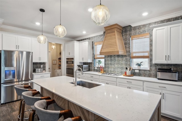 22294 Storybook Cabin Way, Land O Lakes, FL 34637 - kitchen with stainless steel appliances, a sink, ornamental molding, custom exhaust hood, and a breakfast bar