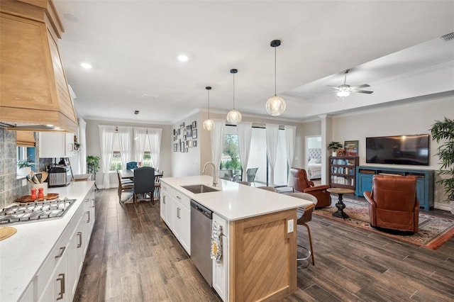 22294 Storybook Cabin Way, Land O Lakes, FL 34637 - kitchen featuring a sink, appliances with stainless steel finishes, dark wood-style floors, light countertops, and a ceiling fan
