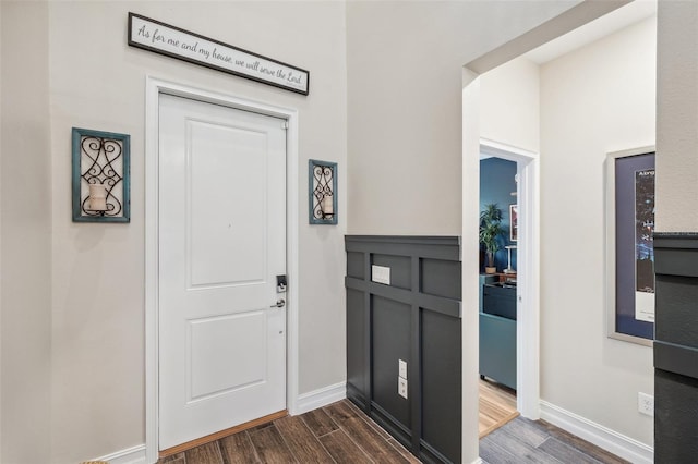 22294 Storybook Cabin Way, Land O Lakes, FL 34637 - foyer entrance featuring dark wood-style floors and baseboards