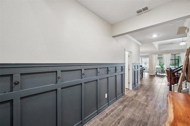 22294 Storybook Cabin Way, Land O Lakes, FL 34637 - hall with wood finished floors, a tray ceiling, and a wainscoted wall