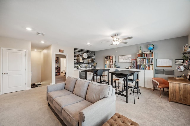 22294 Storybook Cabin Way, Land O Lakes, FL 34637 - living room with beverage cooler, light carpet, ceiling fan, and recessed lighting