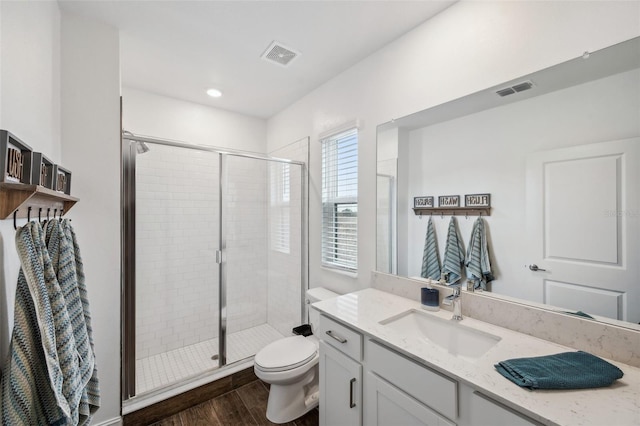 22294 Storybook Cabin Way, Land O Lakes, FL 34637 - full bathroom with a shower stall, wood finished floors, toilet, and vanity