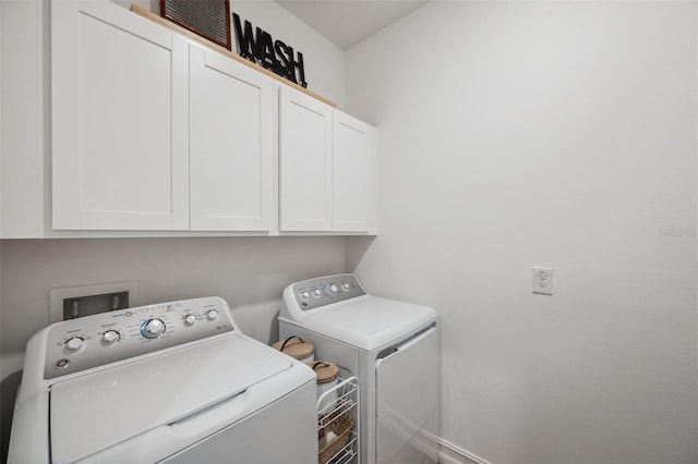 22294 Storybook Cabin Way, Land O Lakes, FL 34637 - laundry room with cabinet space and washer and clothes dryer