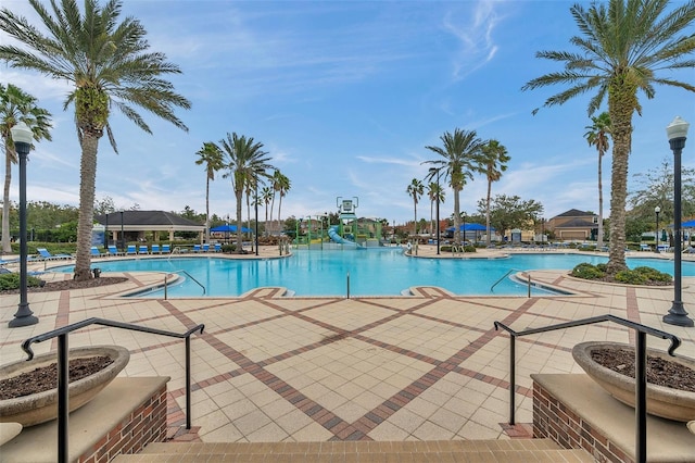22294 Storybook Cabin Way, Land O Lakes, FL 34637 - community pool with a water slide and a patio