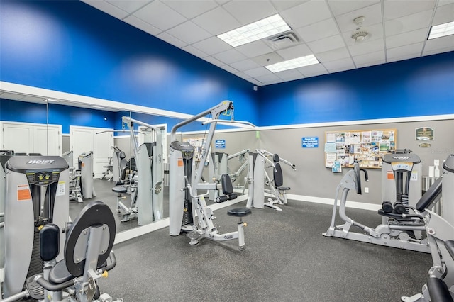 22294 Storybook Cabin Way, Land O Lakes, FL 34637 - exercise room featuring a drop ceiling and baseboards