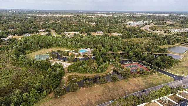 view of property location with a large body of water and a forest