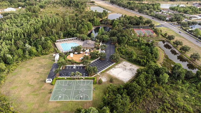 aerial view of property's location featuring a large body of water and a pool