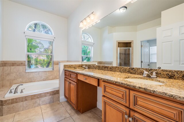 12421 Seabrook Dr, Tampa, FL 33626 - bathroom with a shower stall, a garden tub, tile patterned floors, and double vanity