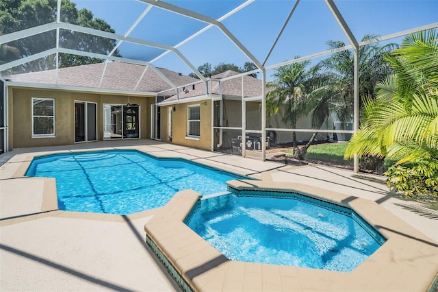 12421 Seabrook Dr, Tampa, FL 33626 - view of pool featuring a patio area, a pool with connected hot tub, and glass enclosure