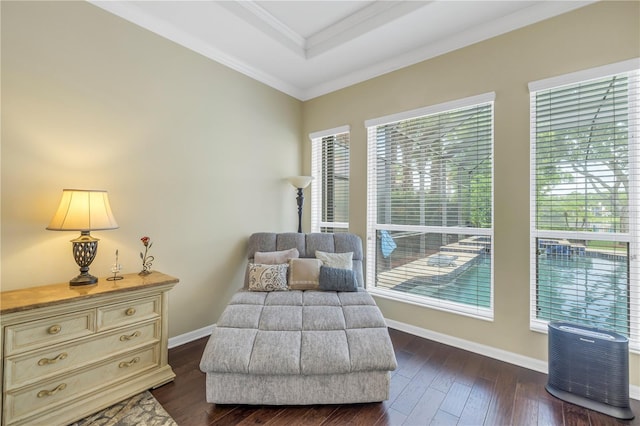 living area featuring ornamental molding, baseboards, and dark wood-style flooring