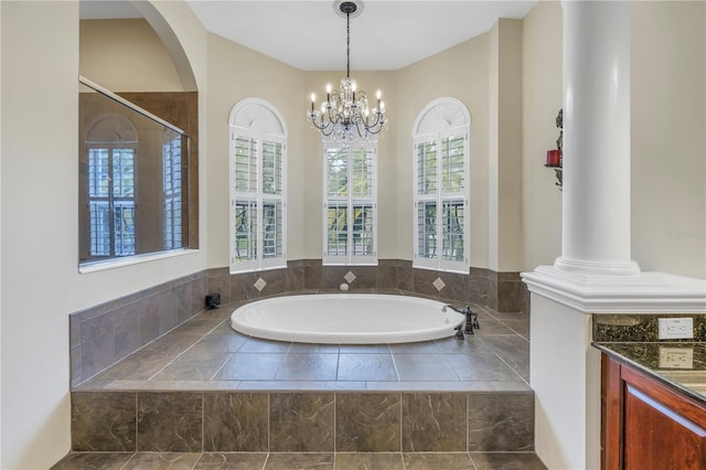 full bath with a bath, a chandelier, and vanity