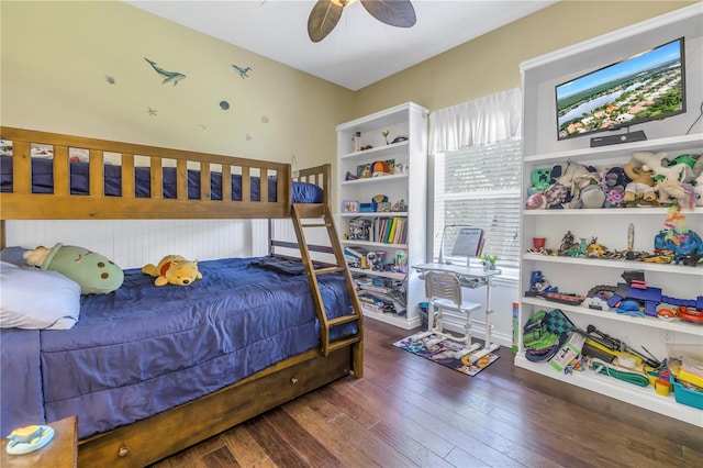 bedroom with wood-type flooring, ceiling fan, and baseboards