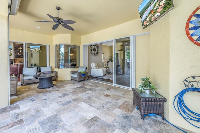 view of patio / terrace featuring ceiling fan