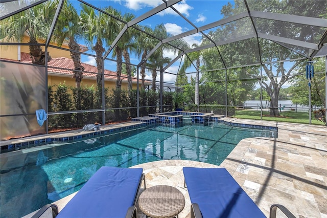 view of pool featuring a pool with connected hot tub, a patio, a lanai, and outdoor dining space