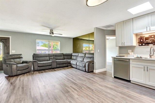 781 Little Pine Dr, South Daytona, FL 32119 - living area with light wood-style flooring, ceiling fan, and baseboards