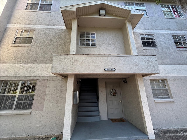 14446 Reuter Strasse Cir Unit 3, Tampa, FL 33613 - doorway to property with stucco siding
