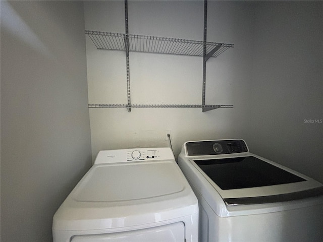 14446 Reuter Strasse Cir Unit 3, Tampa, FL 33613 - washroom with washing machine and clothes dryer