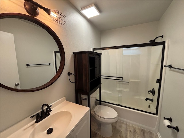 14446 Reuter Strasse Cir Unit 3, Tampa, FL 33613 - full bathroom with wood finished floors, toilet, vanity, and enclosed tub / shower combo