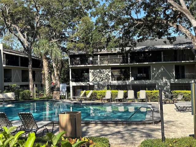 14446 Reuter Strasse Cir Unit 3, Tampa, FL 33613 - community pool featuring a patio