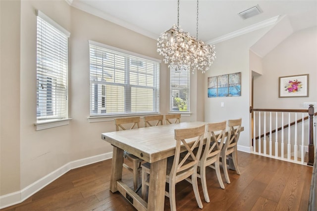 6140 Marina Cove Way S, Saint Petersburg, FL 33712 - dining room with ornamental molding, dark wood-style floors, baseboards, and plenty of natural light