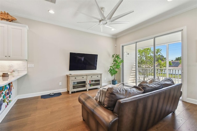 6140 Marina Cove Way S, Saint Petersburg, FL 33712 - living room with a ceiling fan, ornamental molding, baseboards, wood finished floors, and recessed lighting