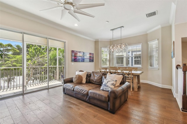 6140 Marina Cove Way S, Saint Petersburg, FL 33712 - living area with wood-type flooring, baseboards, a chandelier, ceiling fan, and ornamental molding