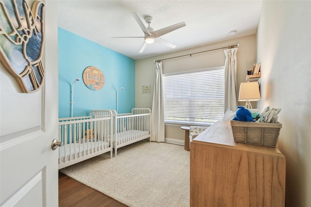 6140 Marina Cove Way S, Saint Petersburg, FL 33712 - bedroom featuring a ceiling fan, baseboards, and wood finished floors