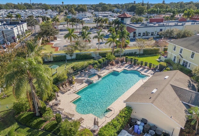 aerial view of residential area featuring a pool