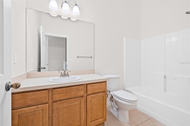 bathroom with toilet, tile patterned floors, and vanity