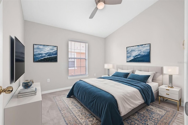 bedroom with light colored carpet, lofted ceiling, baseboards, and ceiling fan