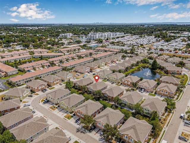 aerial view of property and surrounding area with a large body of water