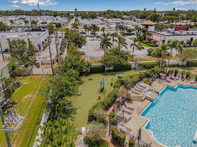 aerial view of residential area with a pool area