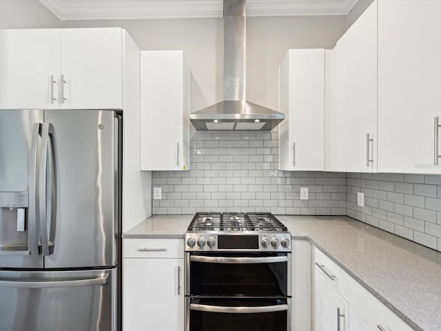 946 Highland Ave Unit 24, Dunedin, FL 34698 - kitchen with stainless steel appliances, wall chimney range hood, crown molding, white cabinetry, and backsplash