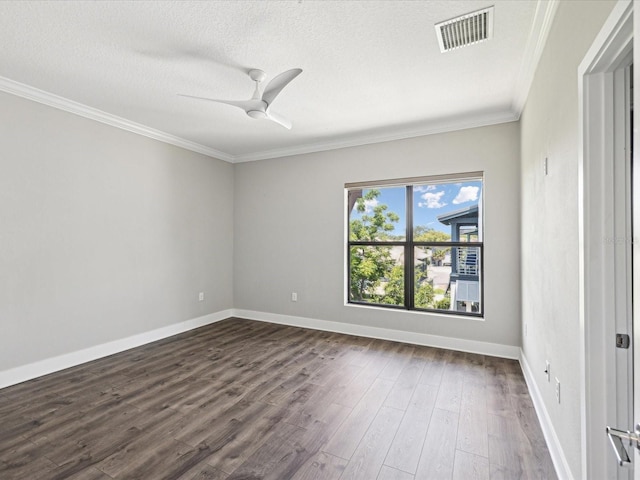 946 Highland Ave Unit 24, Dunedin, FL 34698 - spare room featuring ornamental molding, dark wood-style flooring, ceiling fan, baseboards, and a textured ceiling