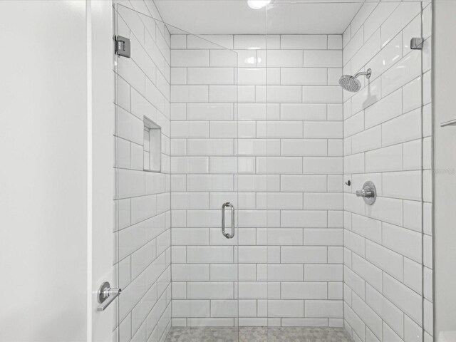 946 Highland Ave Unit 24, Dunedin, FL 34698 - bathroom featuring a stall shower